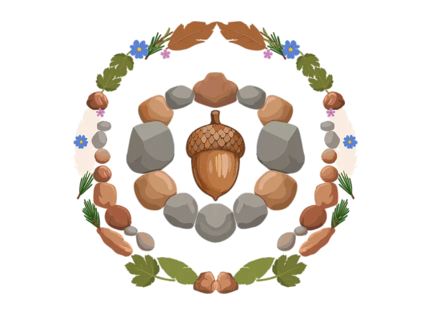 Un gland entouré d’un cercle de pierres, lui-même encerclé de branches et de feuilles d'automne.